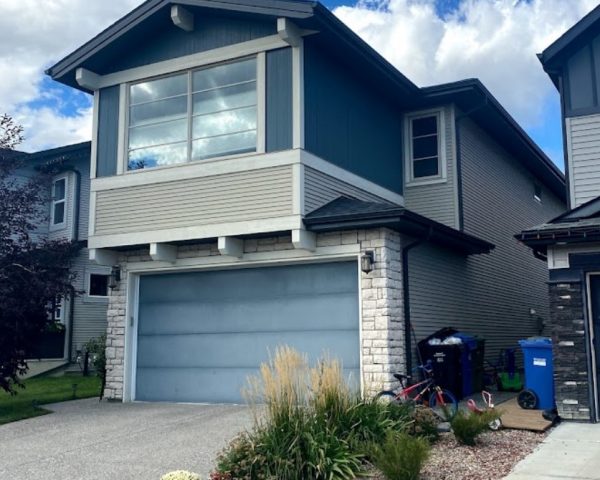 Better Calgary Exteriors crew completing siding installation